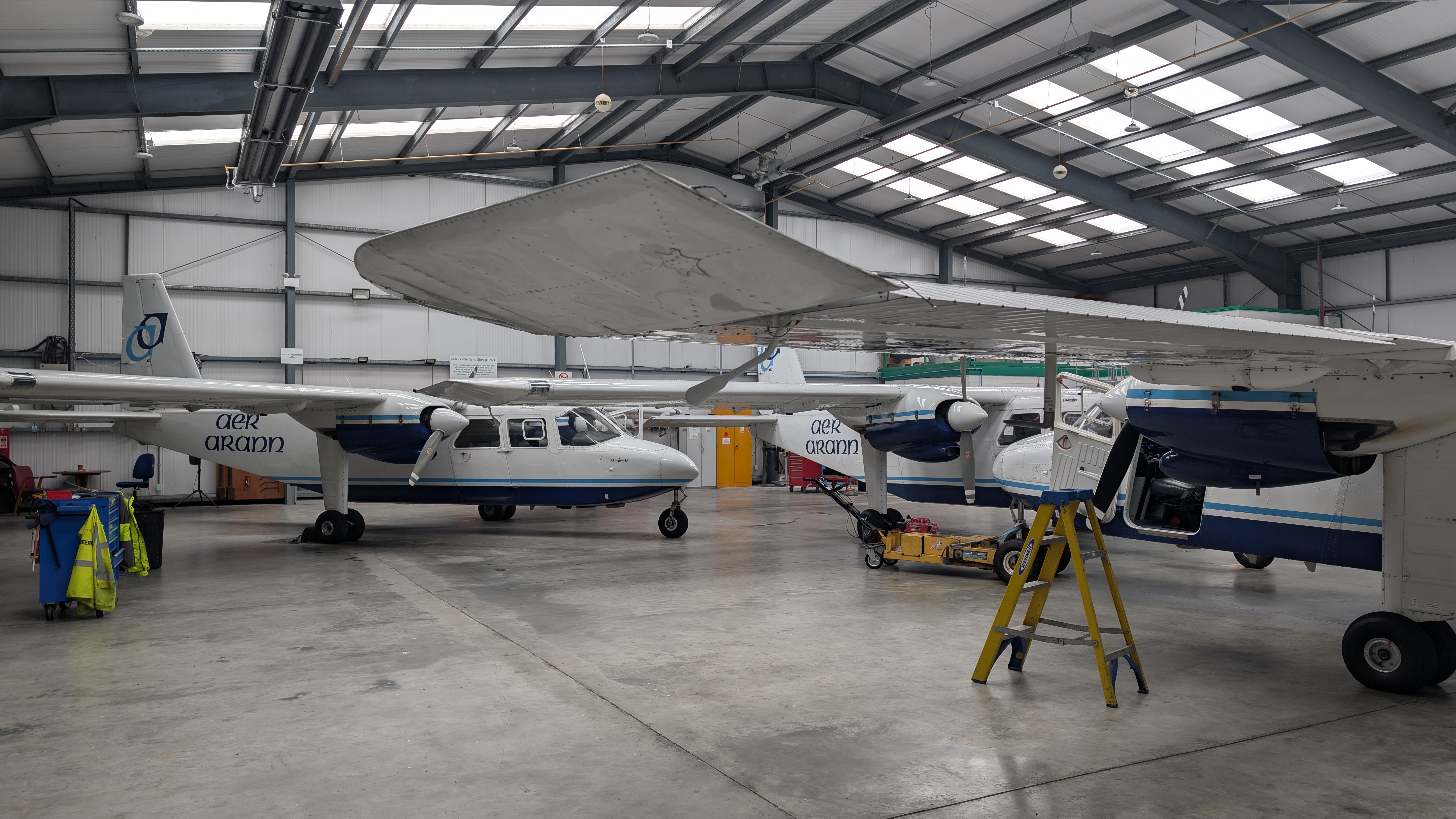 Two of Aer Arann Islands' three Britten-Norman Islander aircraft inside the maintenance hangar at Connemara Airport.
