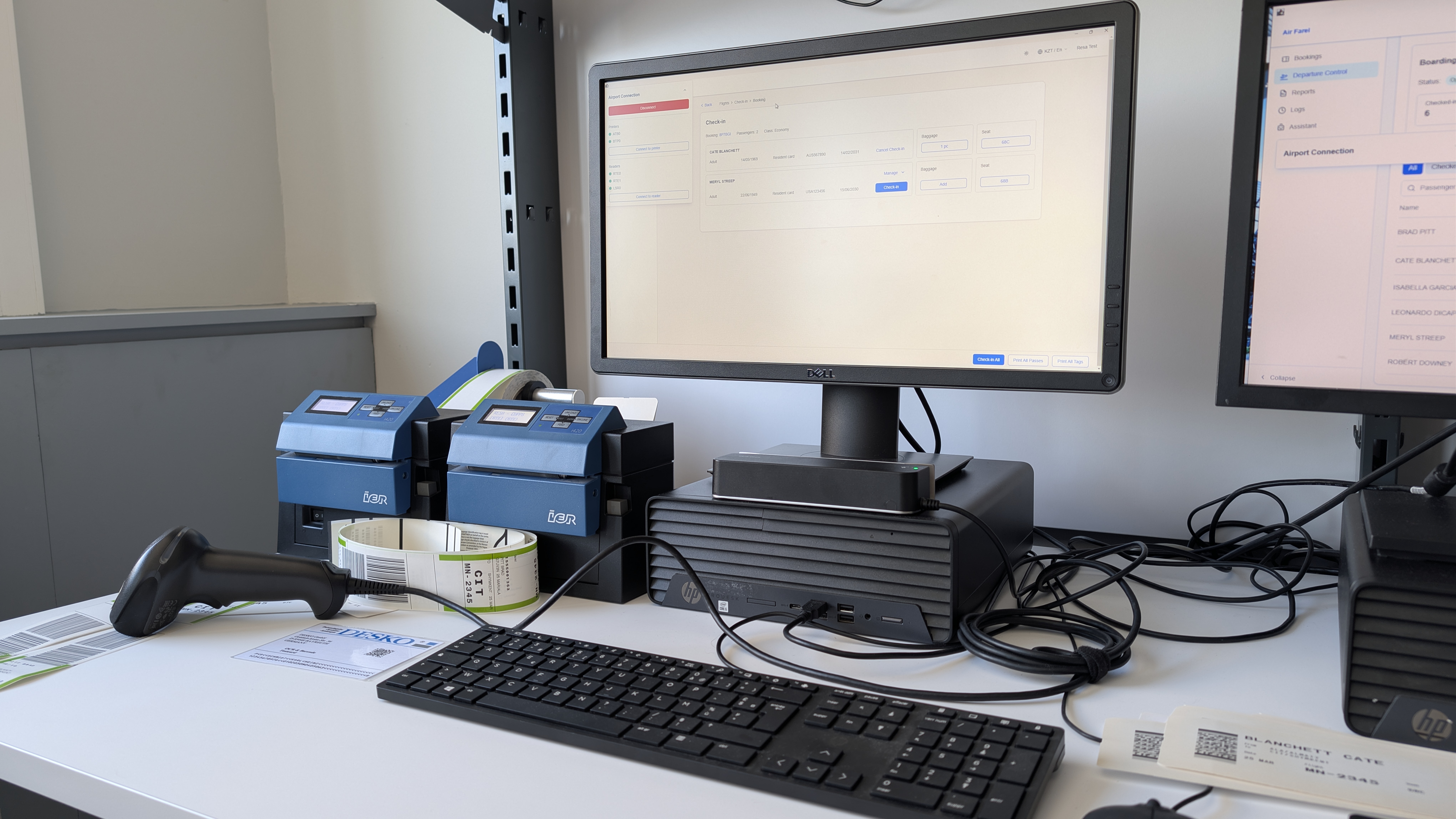 Farel's check-in screen on a common-use workstation during certification, connected to IER bag-tag printers and a document scanner.