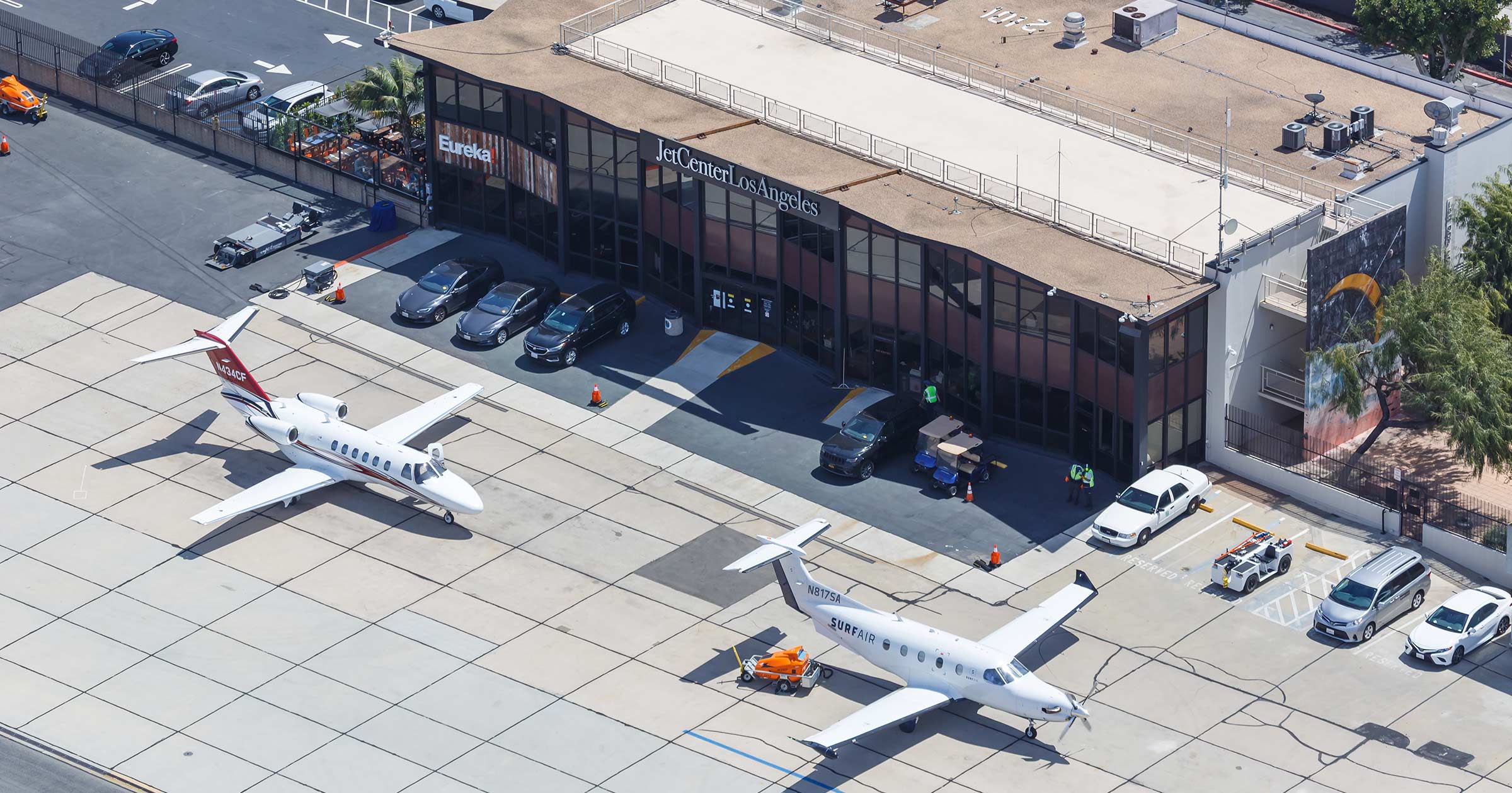 Aerial view of small private jets parked at JetCenter Los Angeles
